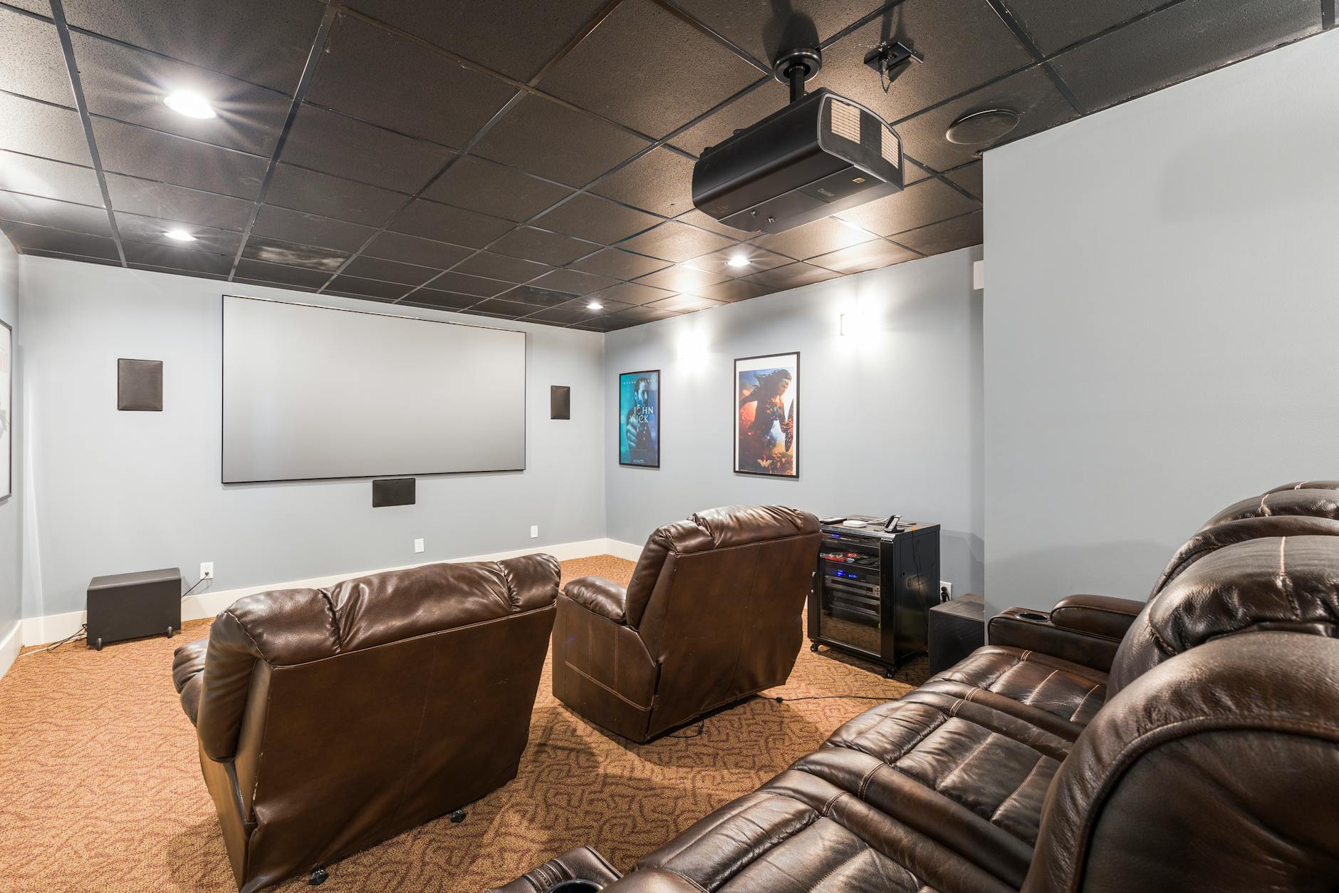 home cinema with comfortable leather armchairs